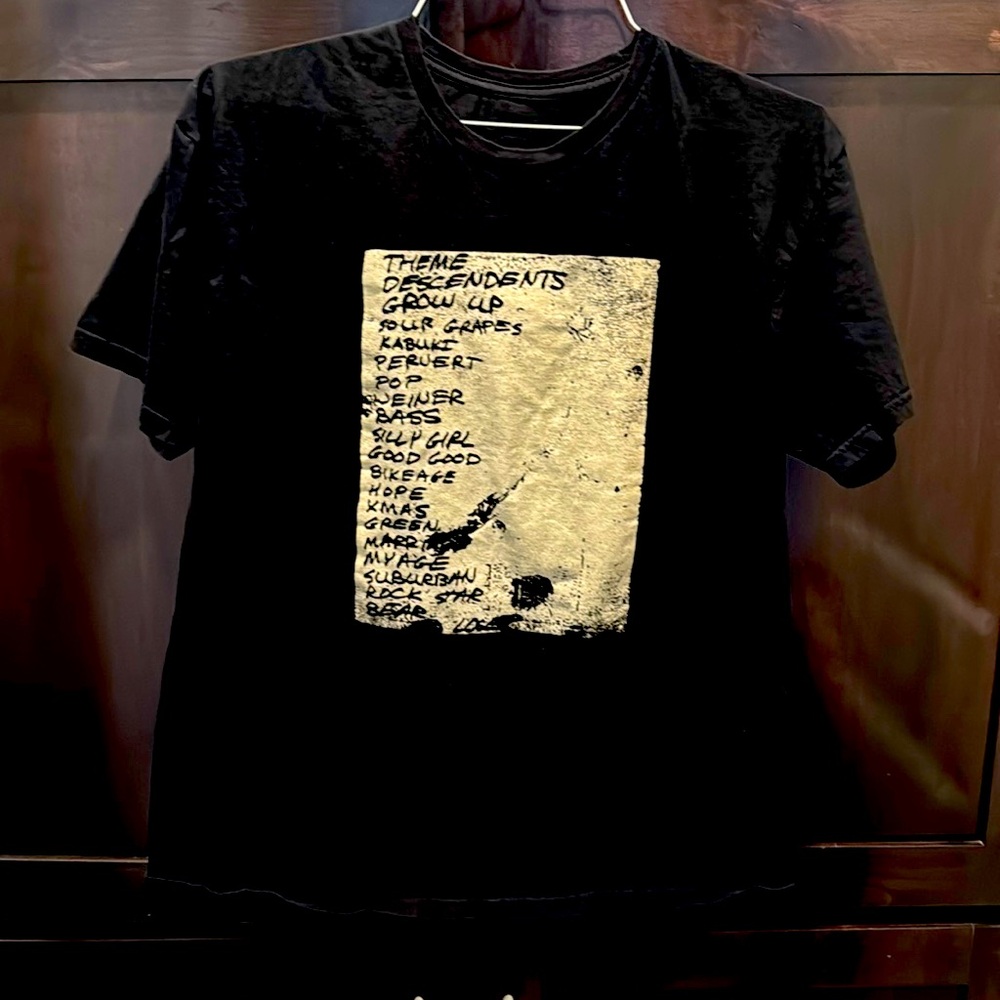 Descendants T shirt . Unlabeled , appears to be a set list.